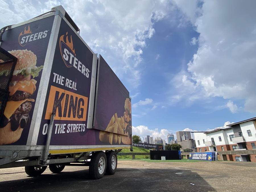 Steers branded trailer under a blue sky